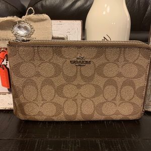 NWOT Coach Wristlet large, signature with orange